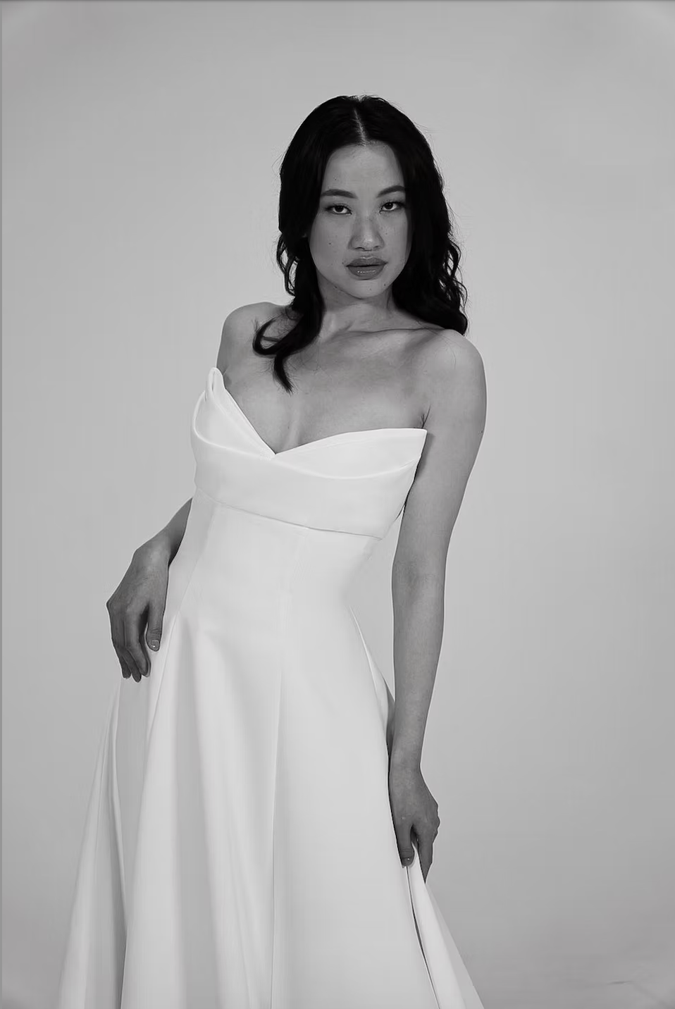 model is wearing a strapless bridal gown