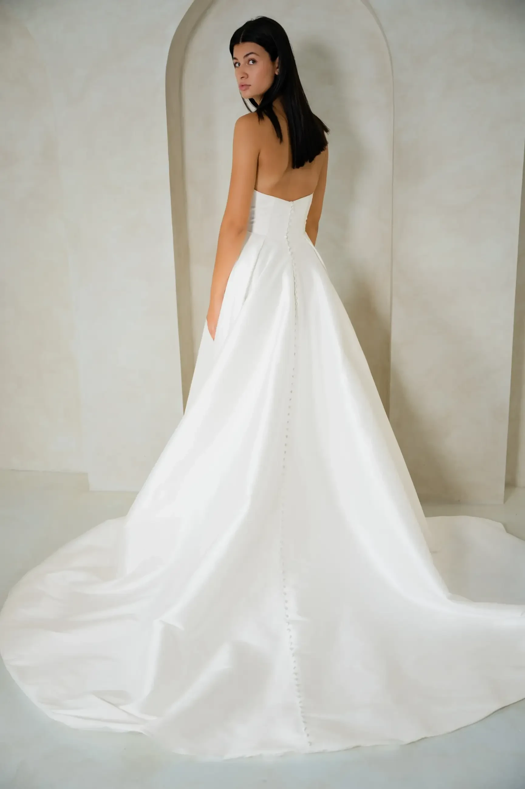 model is wearing a strapless basque waist a-line wedding dress
