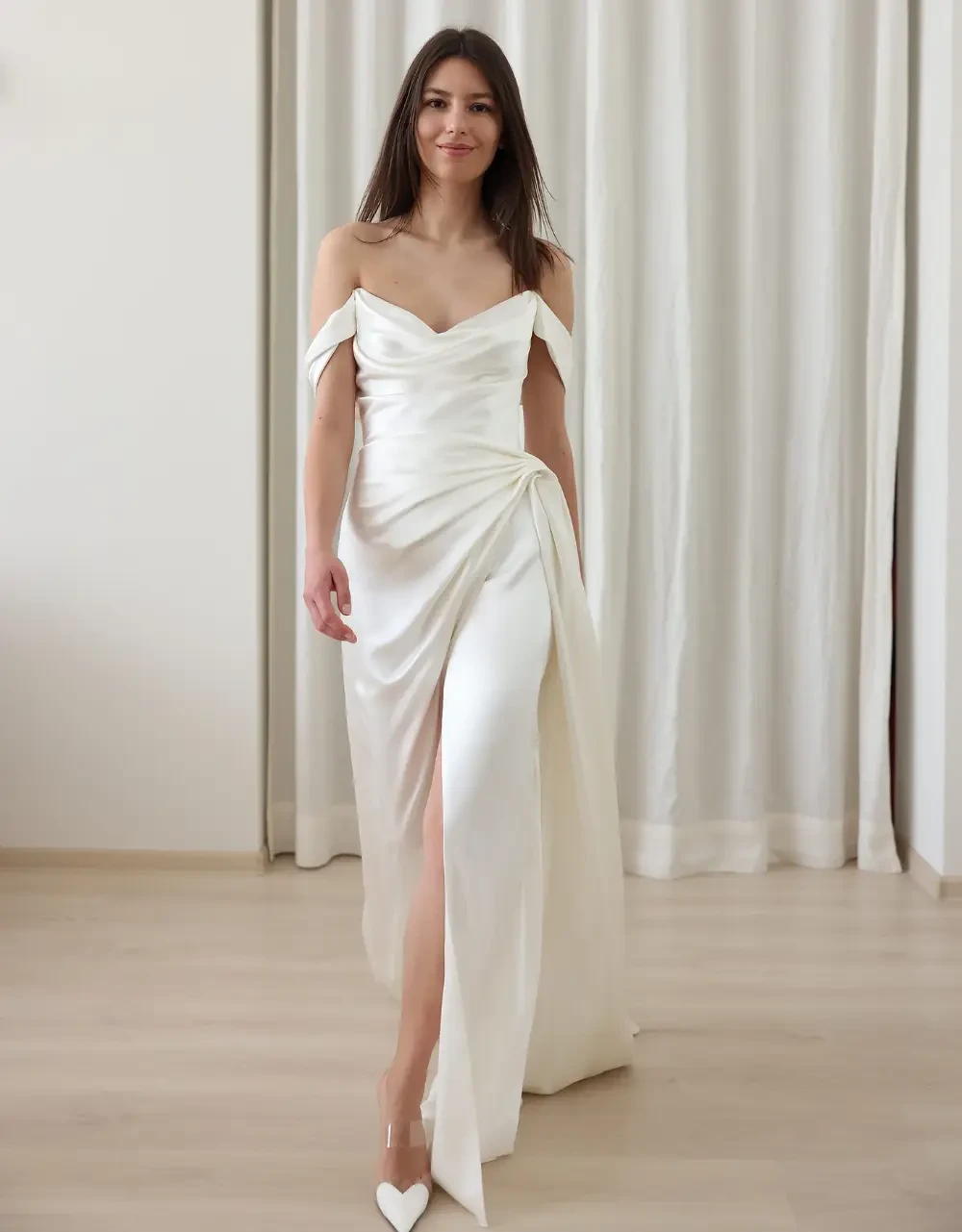 Model wearing a white gown