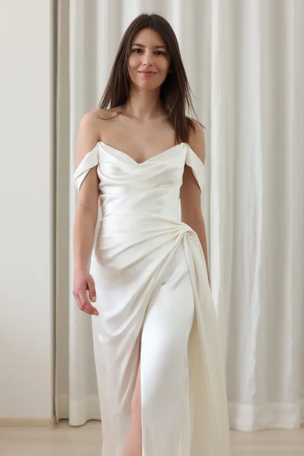 Model wearing a white gown