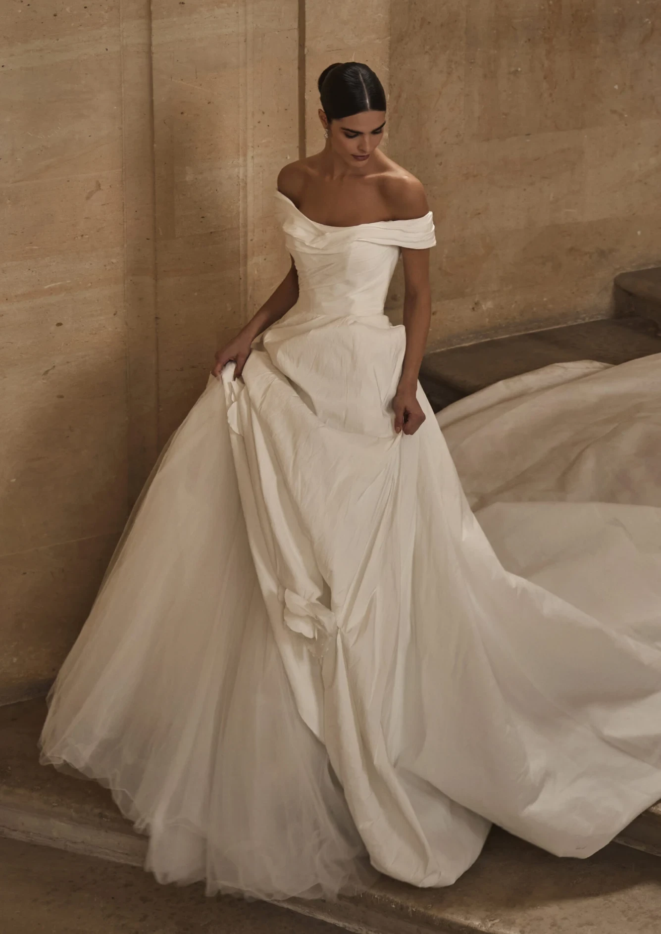 Model wearing a white gown